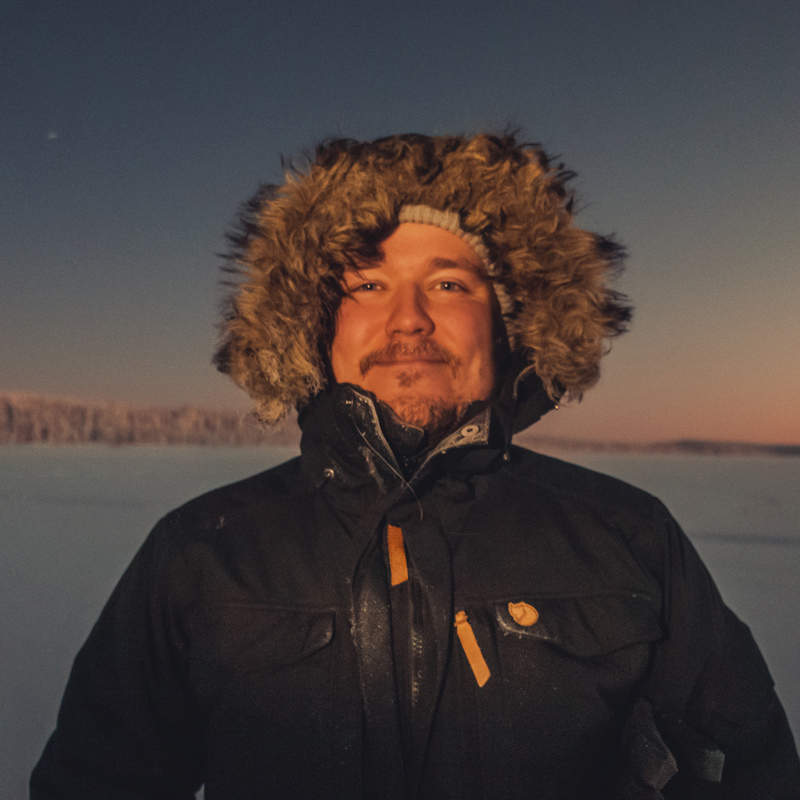 Juhani Vanhatapio portrait in winter clothing.